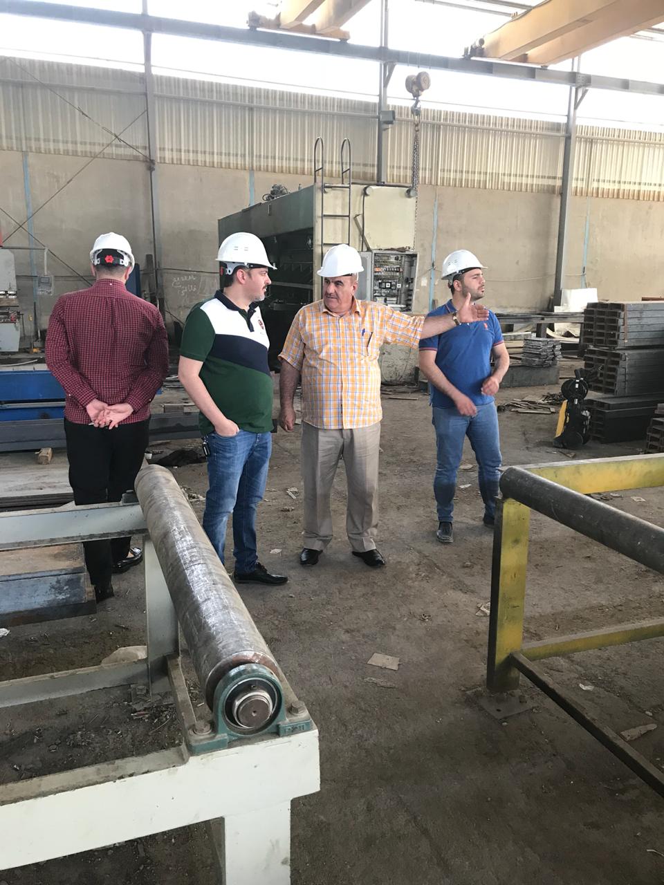 Site inspection inside a steel fabrication workshop in Iraq